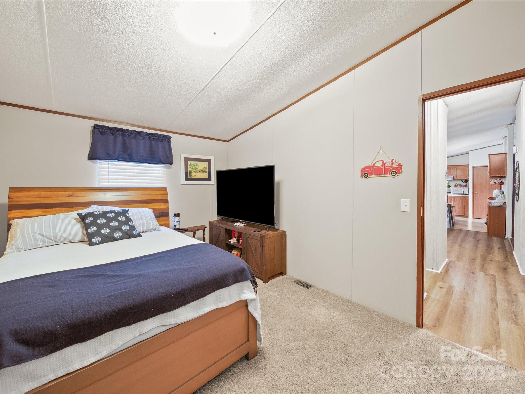 3911 Doster Road Monroe, NC 28112 - Photo 32 of 34 a bedroom with a bed and a television