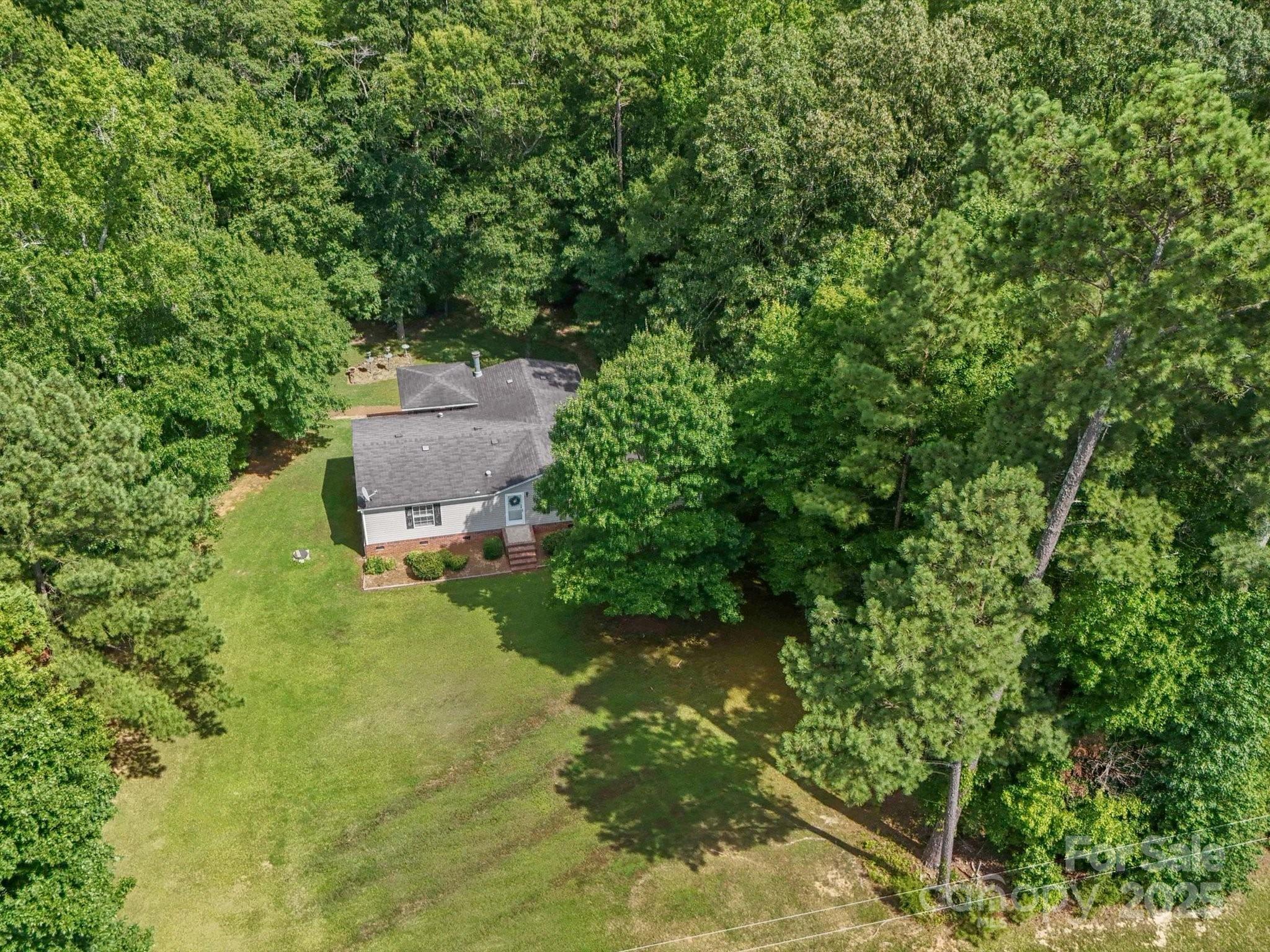 3911 Doster Road Monroe, NC 28112 - Photo 4 of 34 an aerial view of a house with a yard