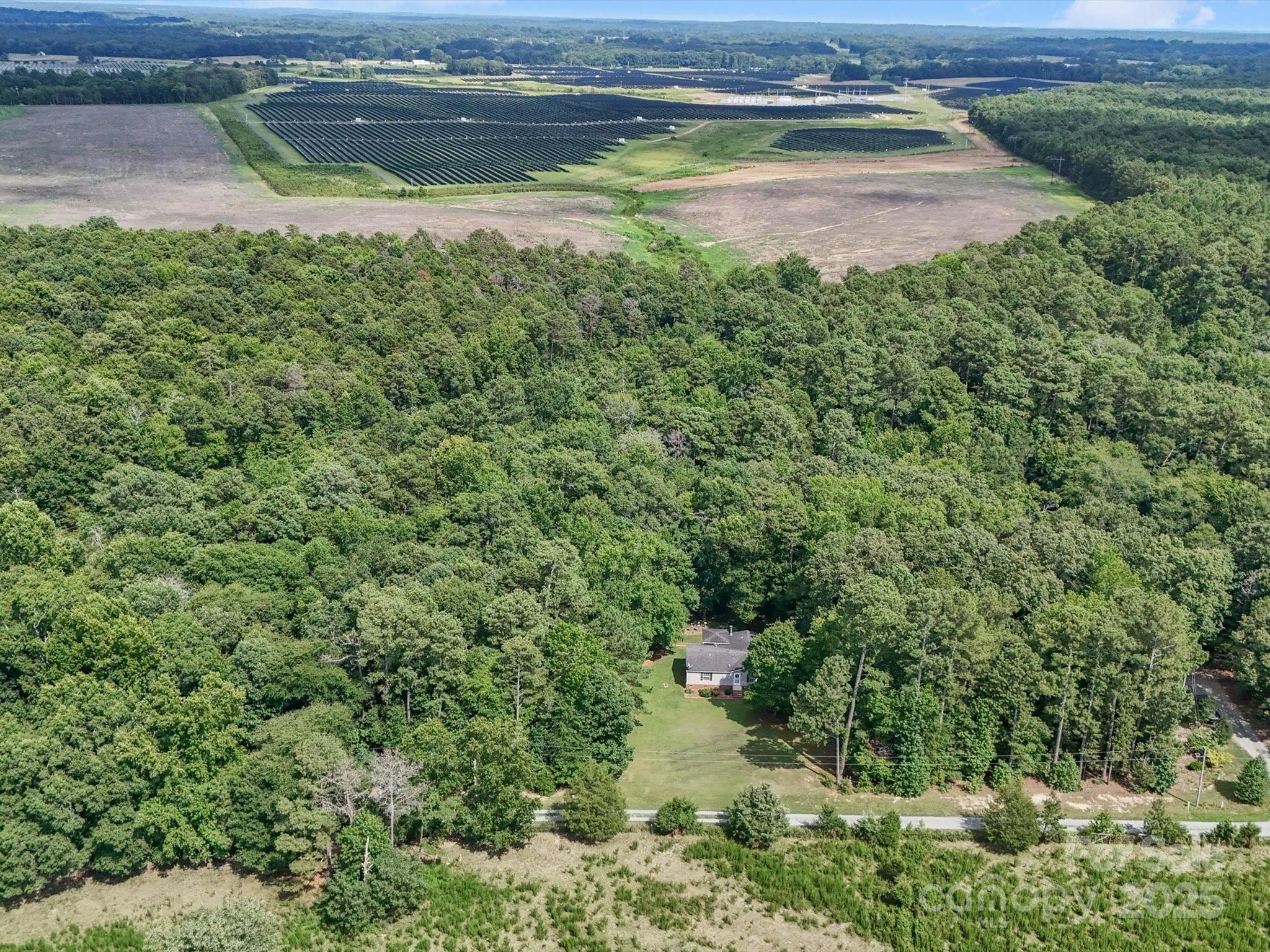 3911 Doster Road Monroe, NC 28112 - Photo 6 of 34 a view of a lake from a yard