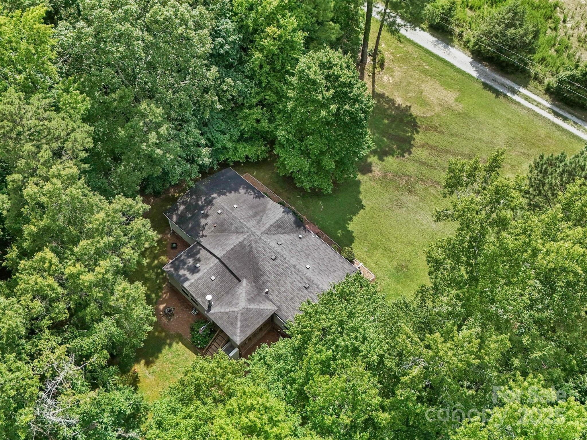 3911 Doster Road Monroe, NC 28112 - Photo 9 of 34 an aerial view of a house with a yard
