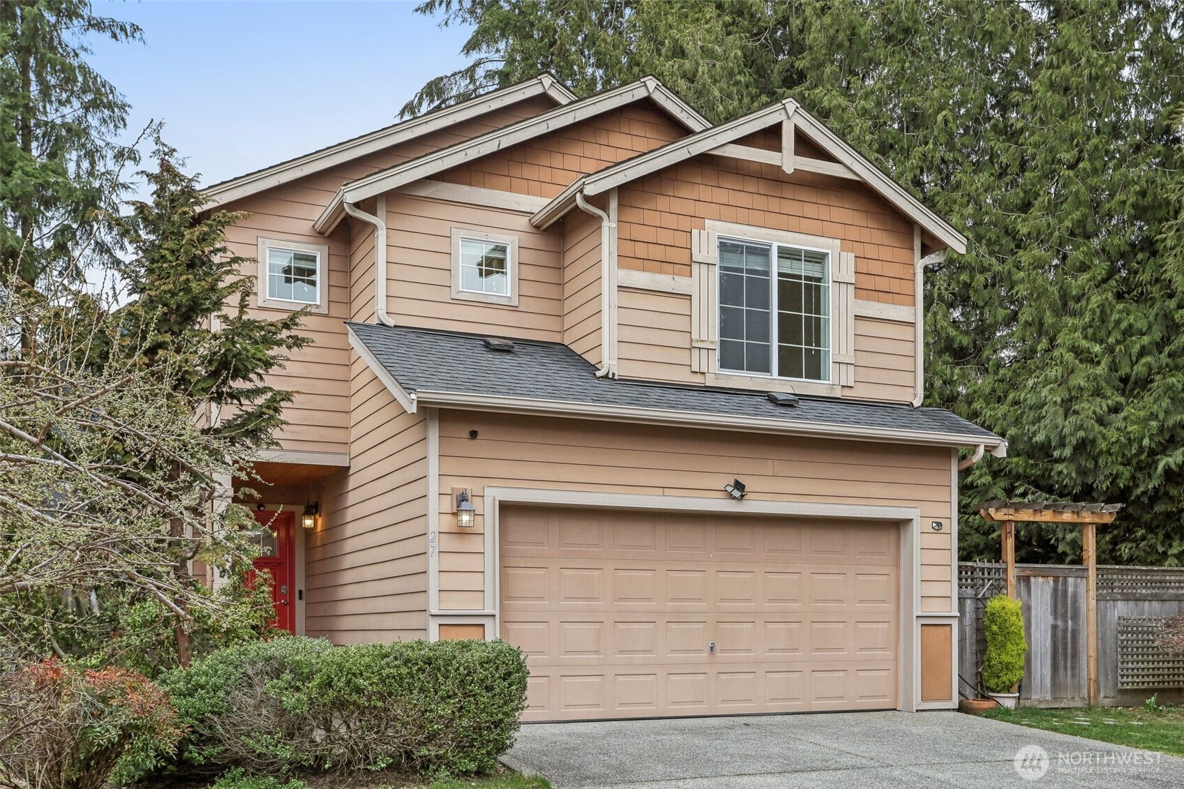 27 193rd Place Southwest, Unit 9 Bothell, WA 98012 - Photo 1 of 26 a front view of a house with a yard