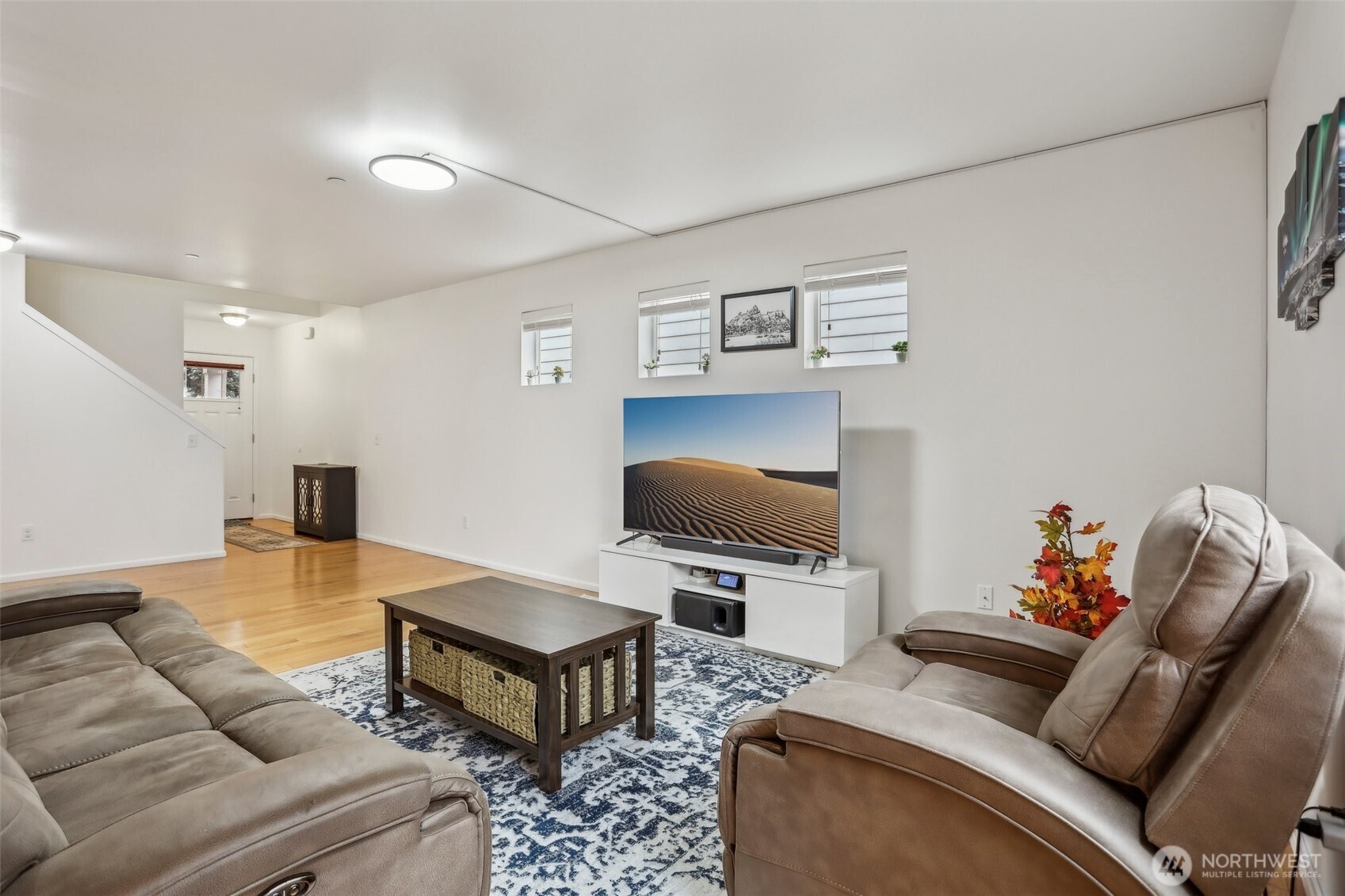27 193rd Place Southwest, Unit 9 Bothell, WA 98012 - Photo 6 of 26 a living room with furniture and a flat screen tv