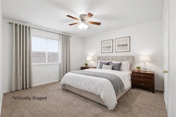 a bedroom with a bed and window