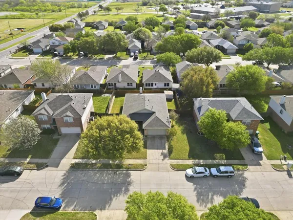 an aerial view of a house with yard swimming pool and outdoor seating
