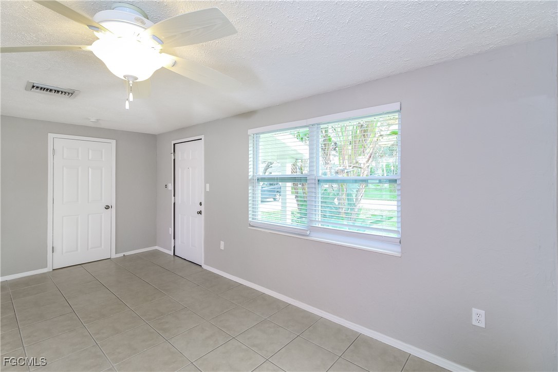 4215 Tarpon Road Venice, FL 34293 - Photo 2 of 16 a view of an empty room with a window