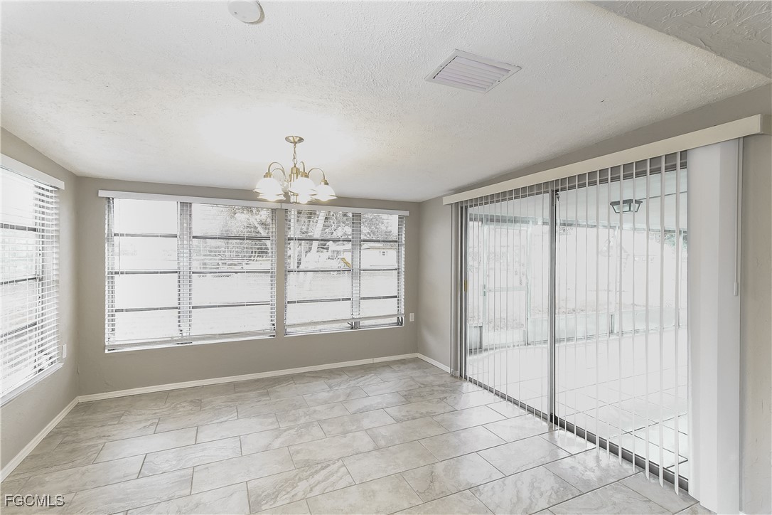 4215 Tarpon Road Venice, FL 34293 - Photo 7 of 16 a view of an empty room with a window