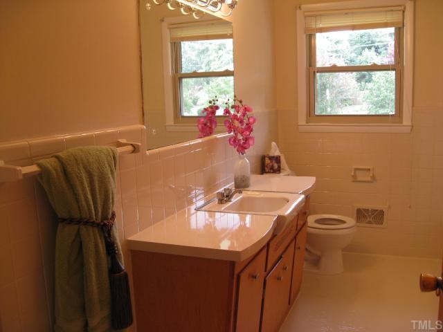 205 Reynolds Road Raleigh, NC 27609 - Photo 4 of 5 a bathroom with a sink and a mirror