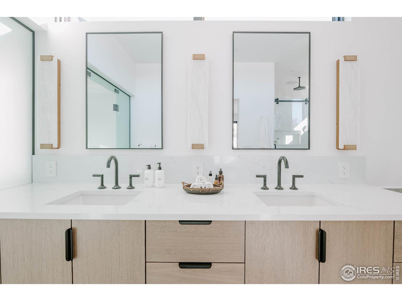 1175 Georgetown Road Boulder, CO 80305 - Photo 21 of 40 Double rift sawn oak floating vanity with black and brass accents.