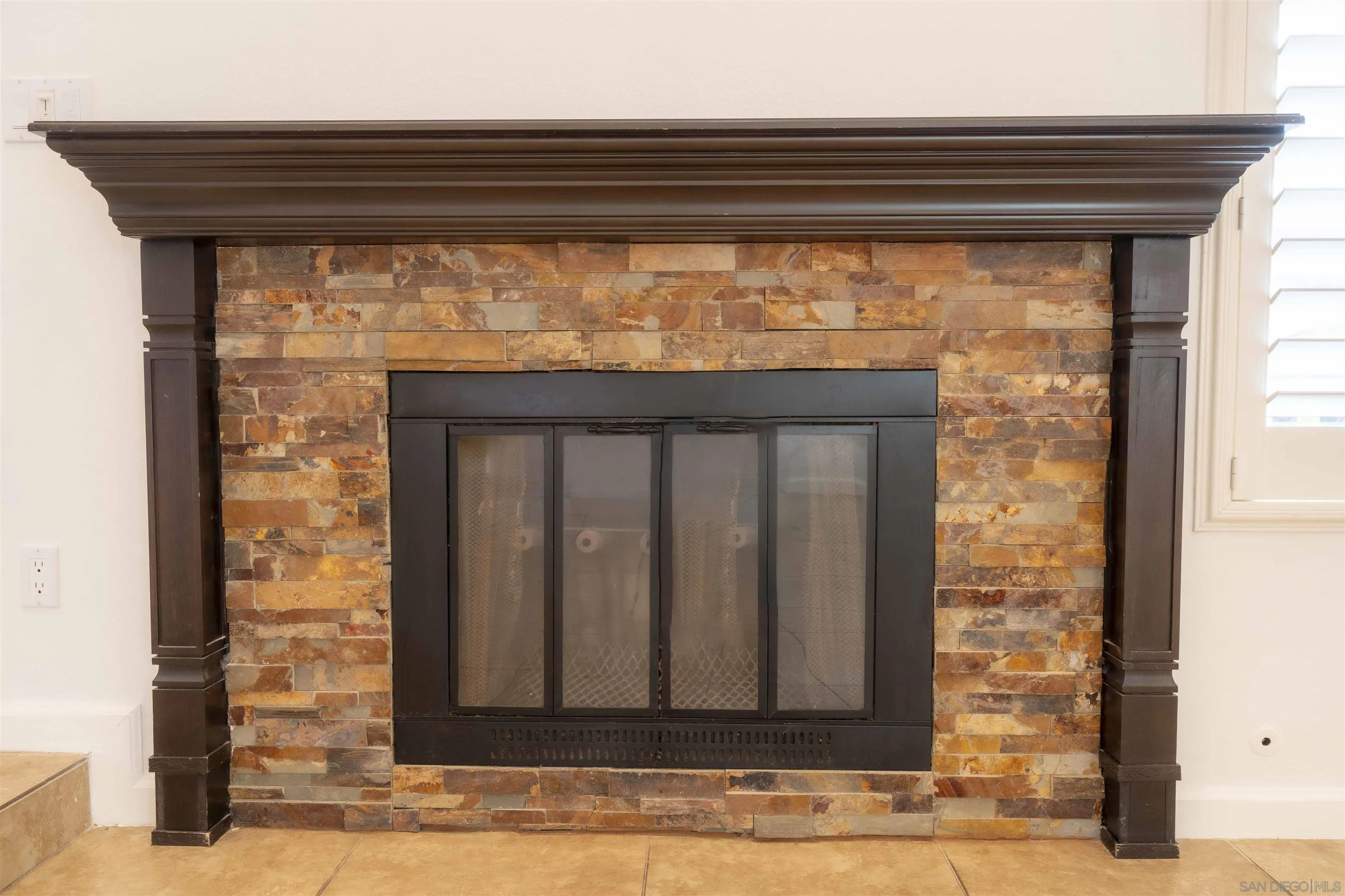 10858 Buggywhip Drive Spring Valley, CA 91978 - Photo 11 of 51 a view of a fireplace door