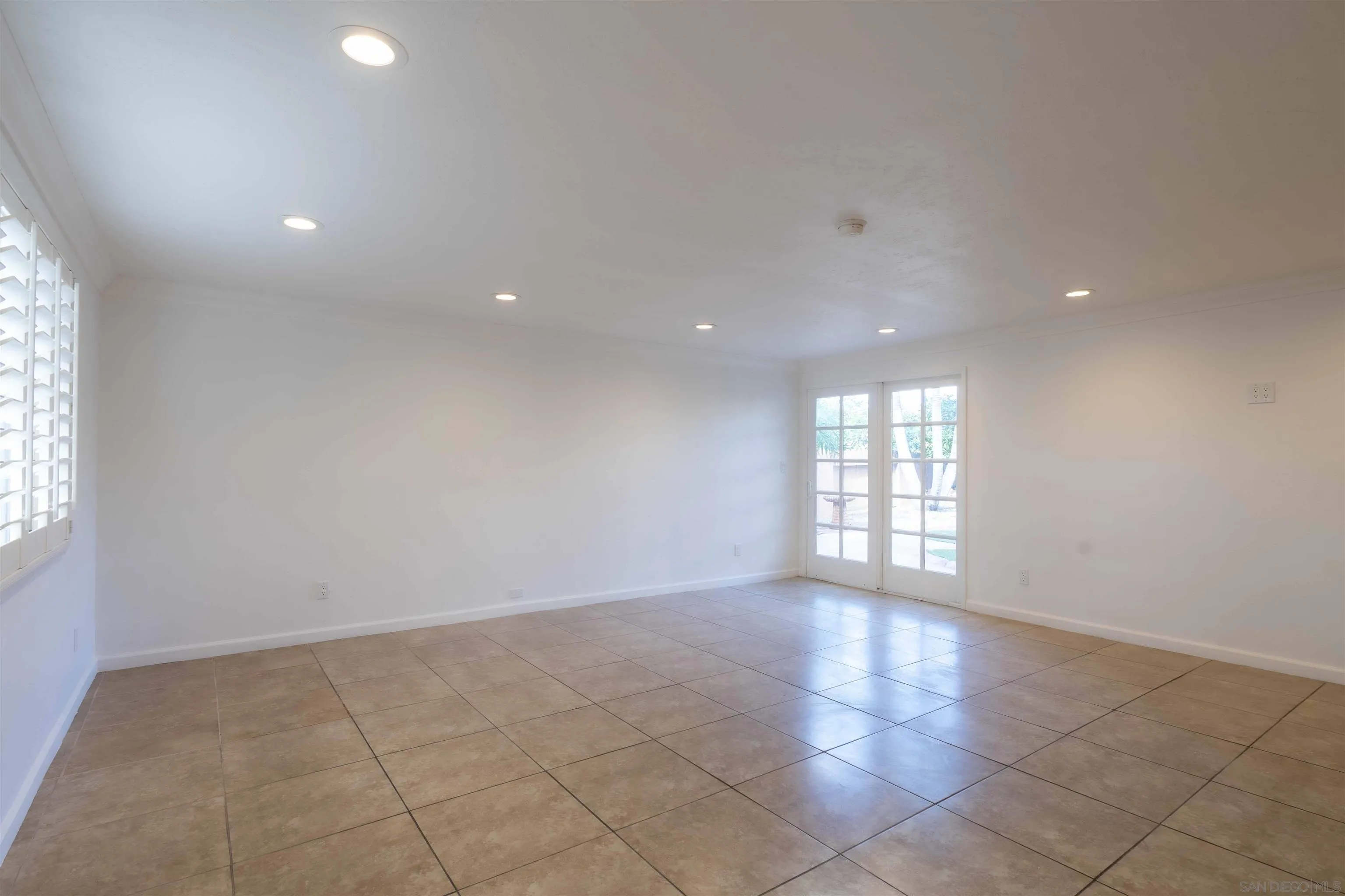 10858 Buggywhip Drive Spring Valley, CA 91978 - Photo 16 of 51 a view of an empty room with a window