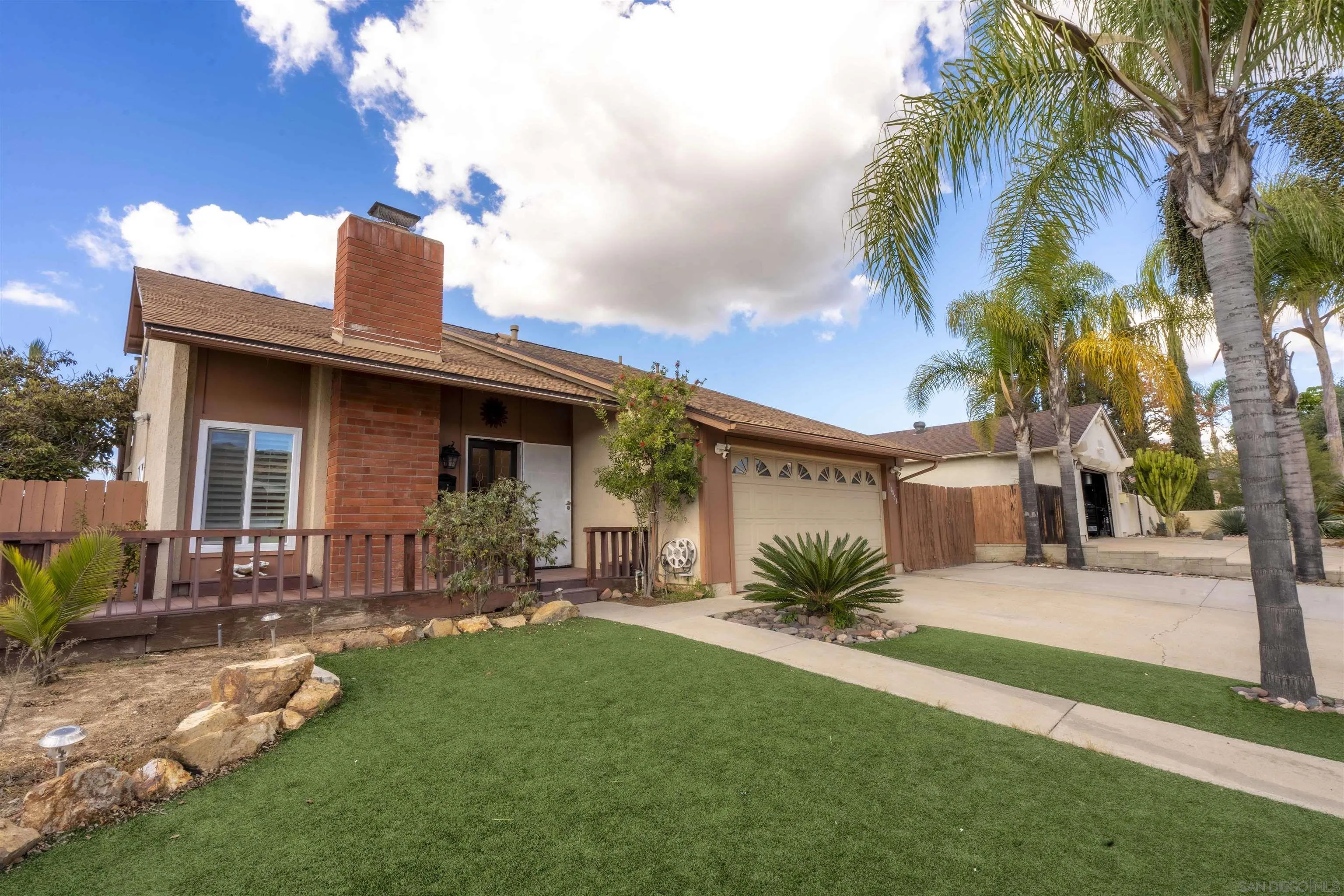 10858 Buggywhip Drive Spring Valley, CA 91978 - Photo 2 of 51 a front view of house with yard and outdoor seating