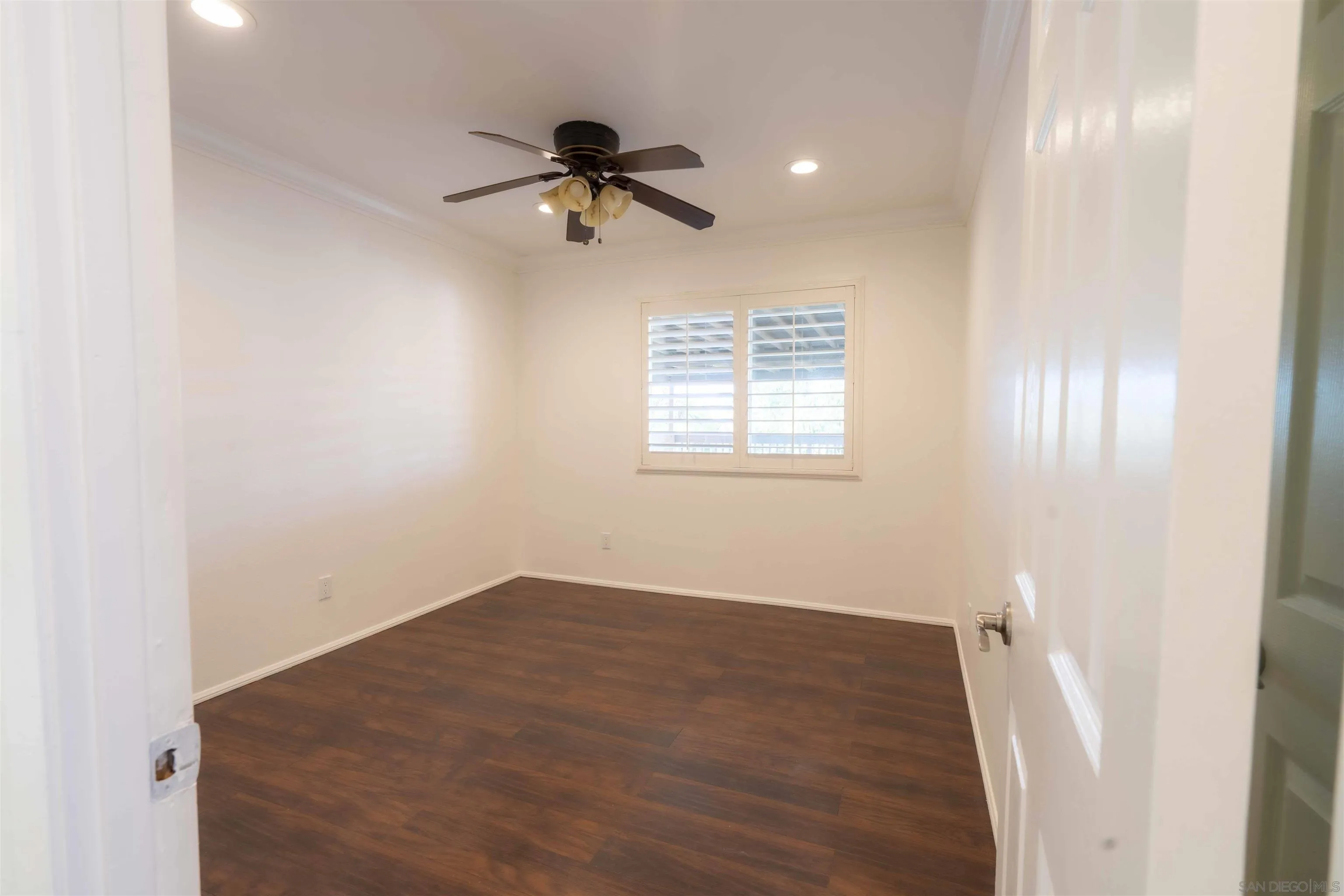 10858 Buggywhip Drive Spring Valley, CA 91978 - Photo 26 of 51 a view of an empty room with a window