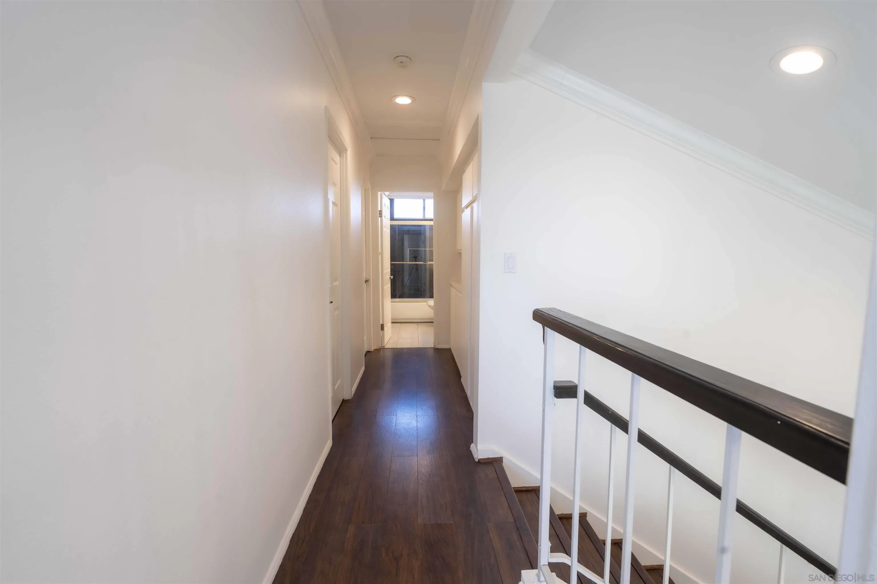 10858 Buggywhip Drive Spring Valley, CA 91978 - Photo 28 of 51 a view of a hallway with wooden floor