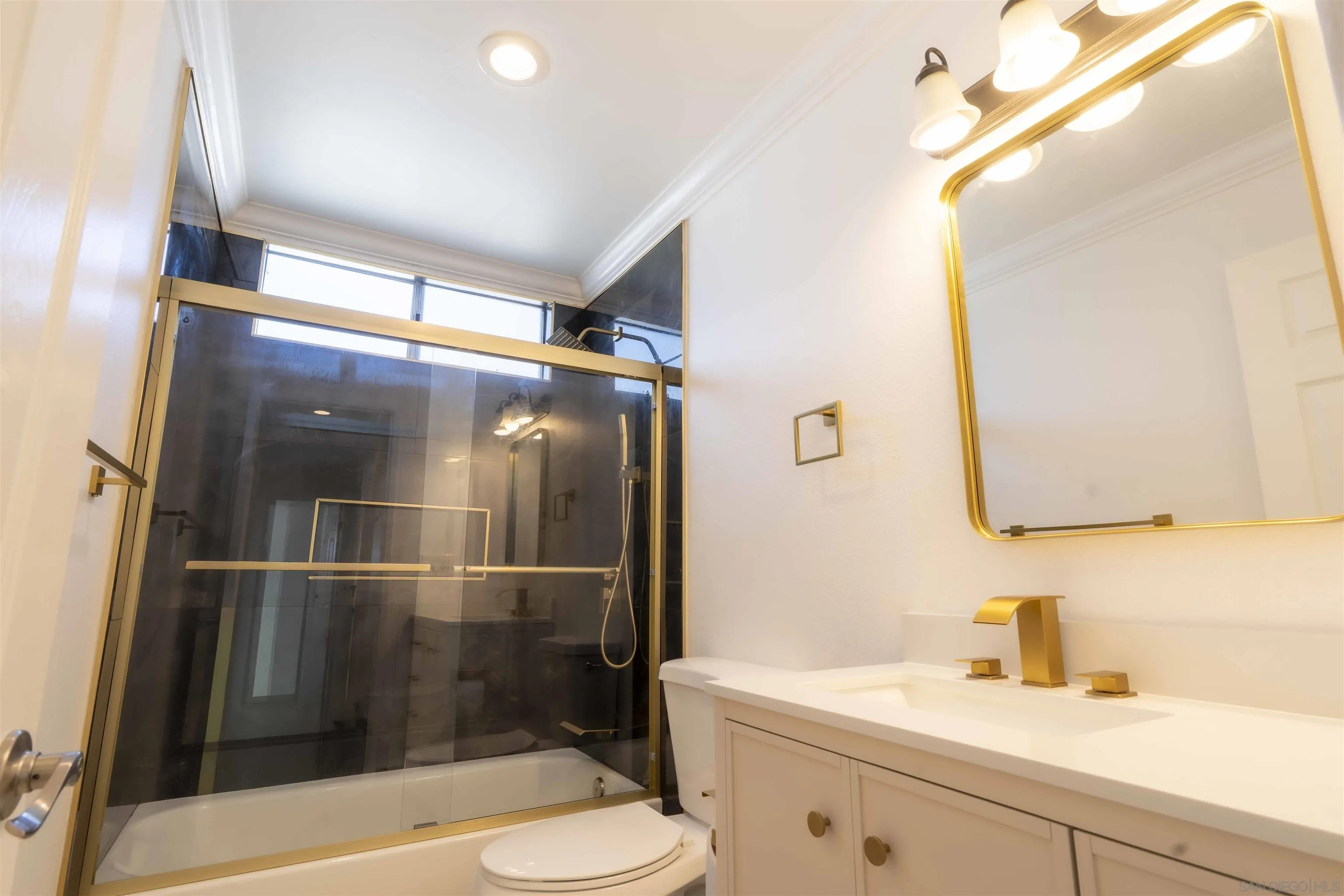 10858 Buggywhip Drive Spring Valley, CA 91978 - Photo 29 of 51 a bathroom with a sink a toilet and shower