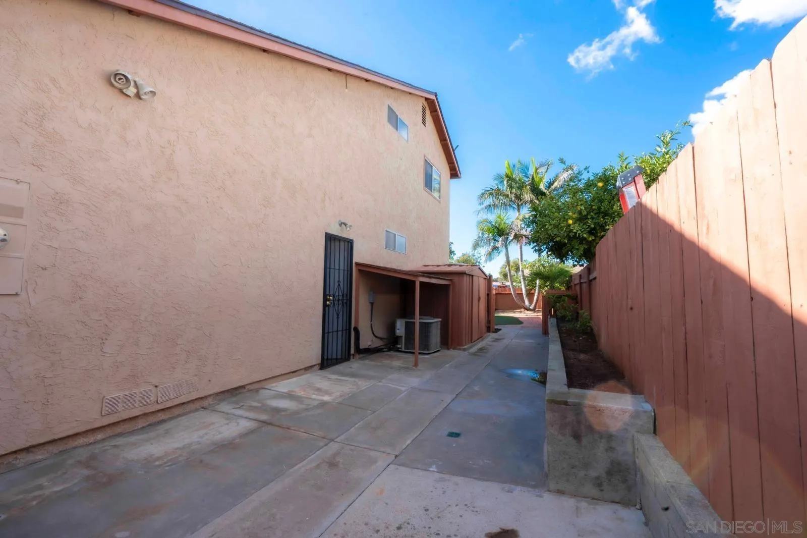 10858 Buggywhip Drive Spring Valley, CA 91978 - Photo 44 of 51 a view of a house with a backyard and potted plants