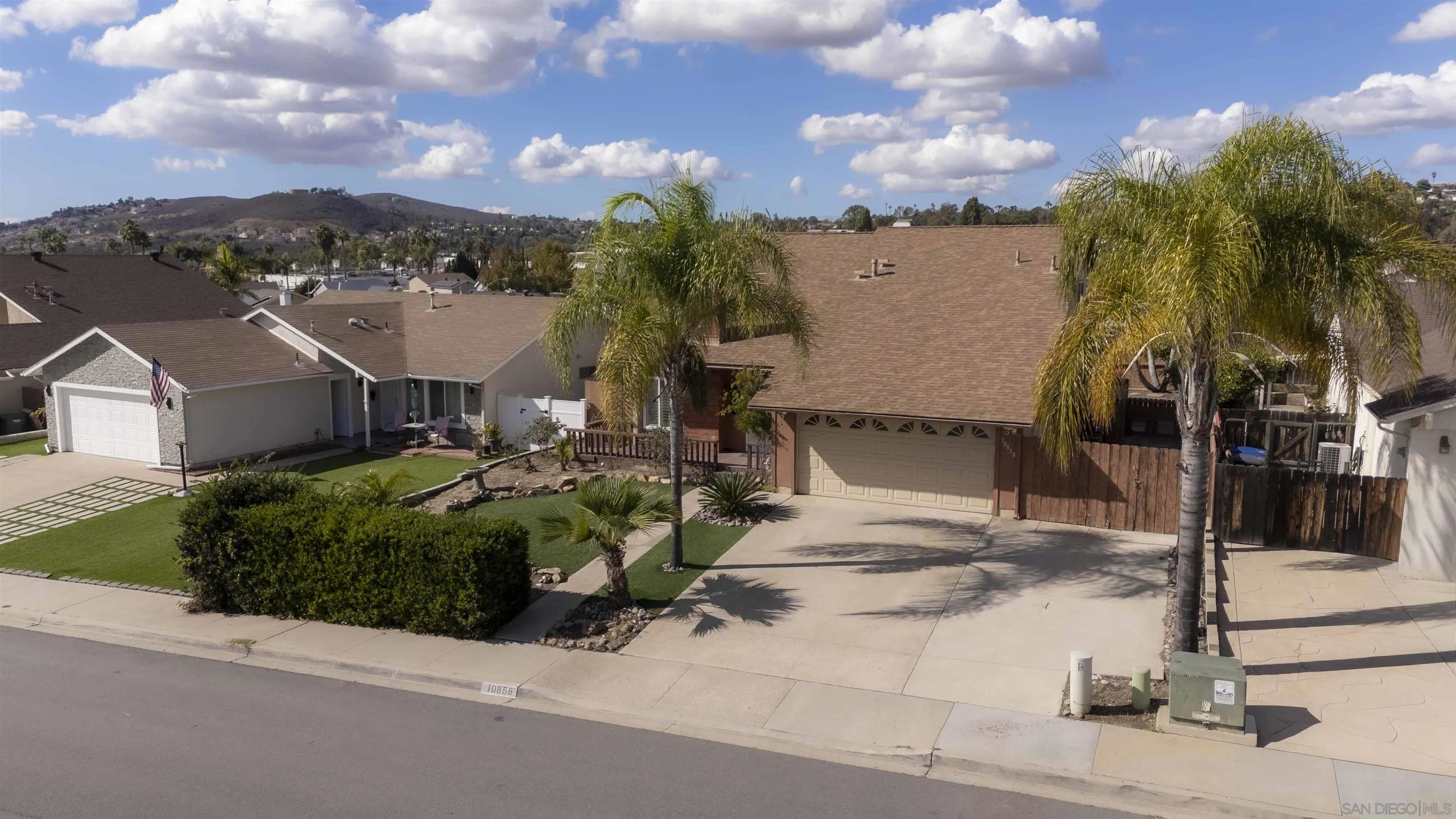 10858 Buggywhip Drive Spring Valley, CA 91978 - Photo 47 of 51 a view of a house with a yard and sitting area