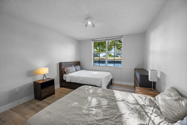 a bedroom with a bed and a chair