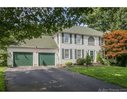 22 Garrison Road Dracut, MA 01826 - Photo 33 of 36 a front view of a house with a garden