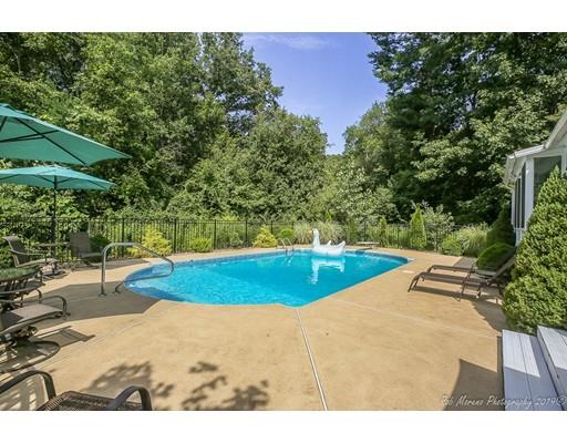 22 Garrison Road Dracut, MA 01826 - Photo 4 of 36 a view of a swimming pool with an outdoor space