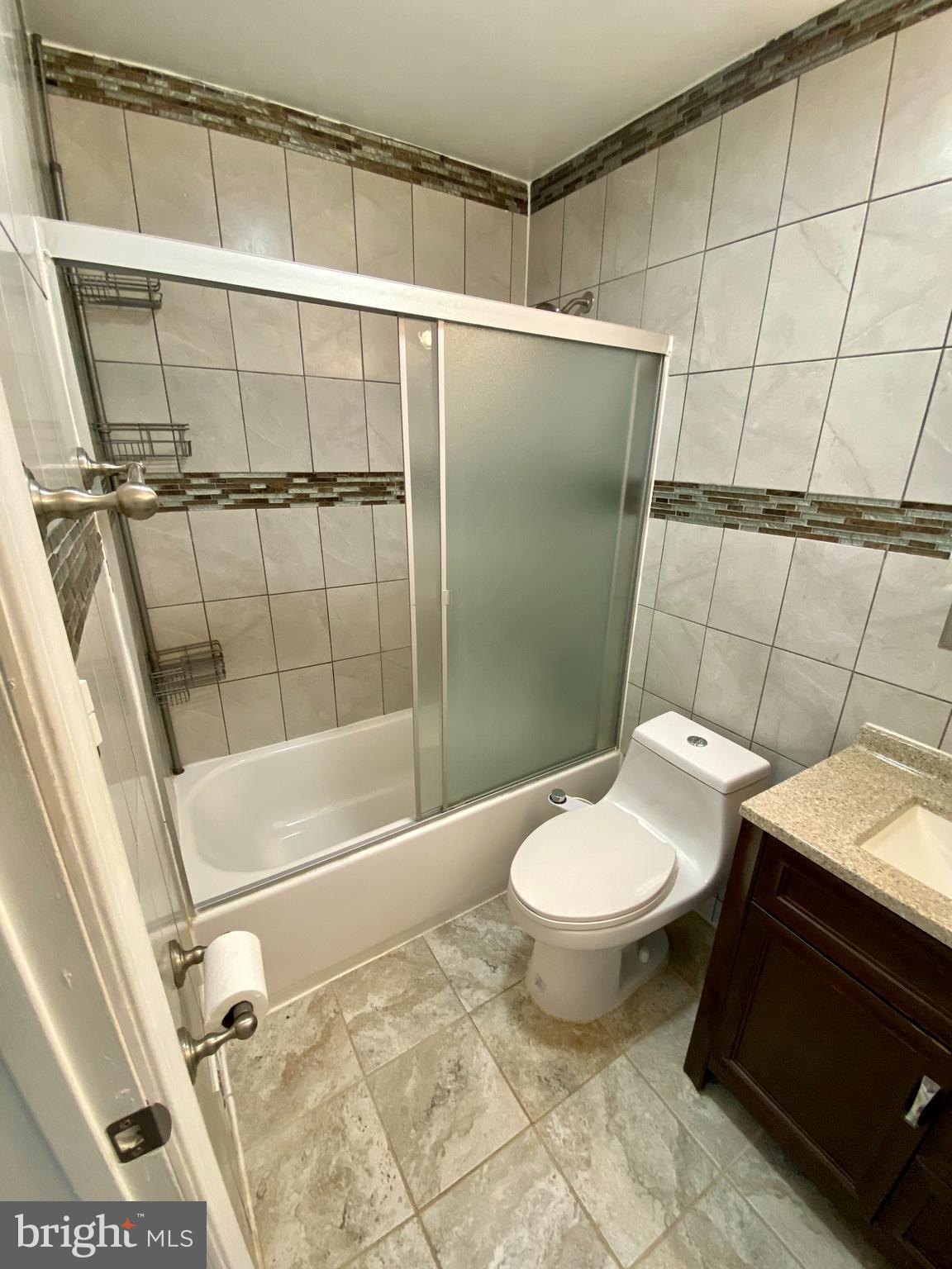 8852 Cork County Court Springfield, VA 22152 - Photo 20 of 31 a bathroom with a toilet and a shower