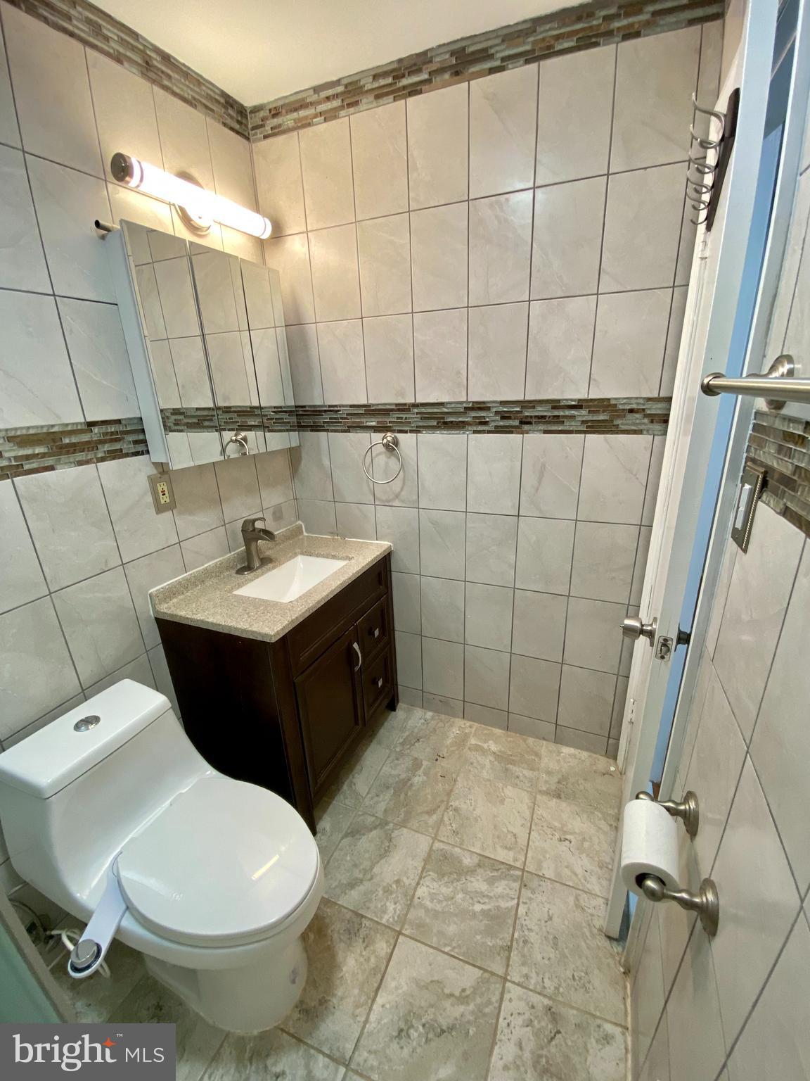 8852 Cork County Court Springfield, VA 22152 - Photo 21 of 31 a bathroom with a sink toilet and shower