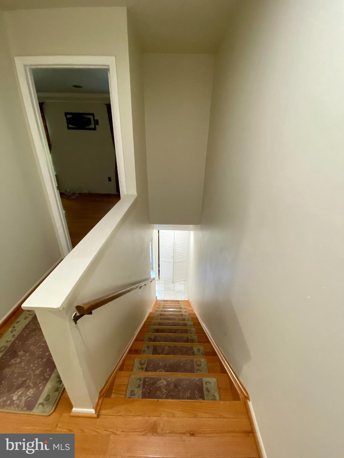 8852 Cork County Court Springfield, VA 22152 - Photo 22 of 31 a view of a hallway with stairs