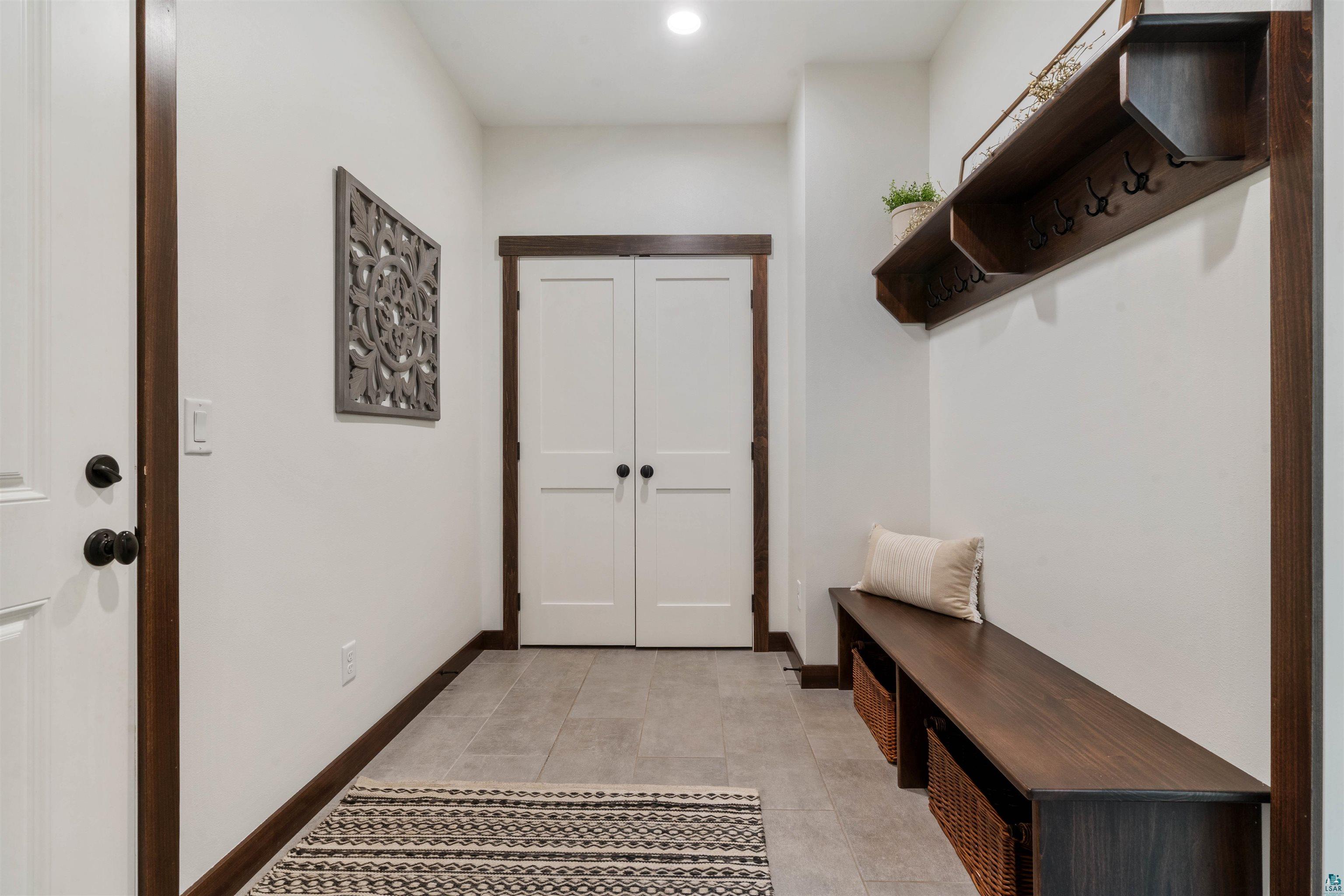 59 East Riverside Road Esko, MN 55733 - Photo 16 of 48 Mudroom with light tile patterned floors and recessed lighting