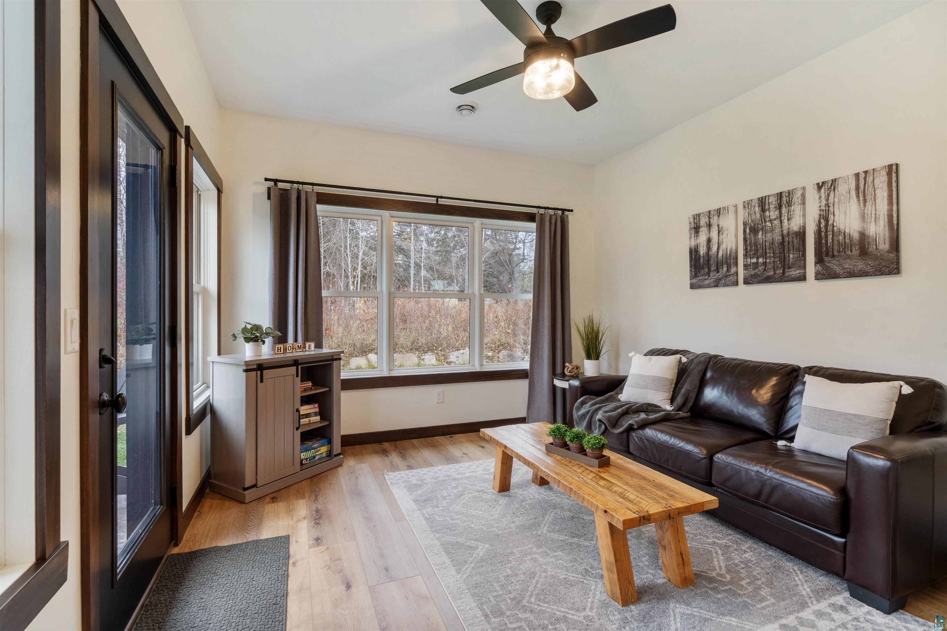 59 East Riverside Road Esko, MN 55733 - Photo 21 of 48 Living area featuring light wood-type flooring and a ceiling fan
