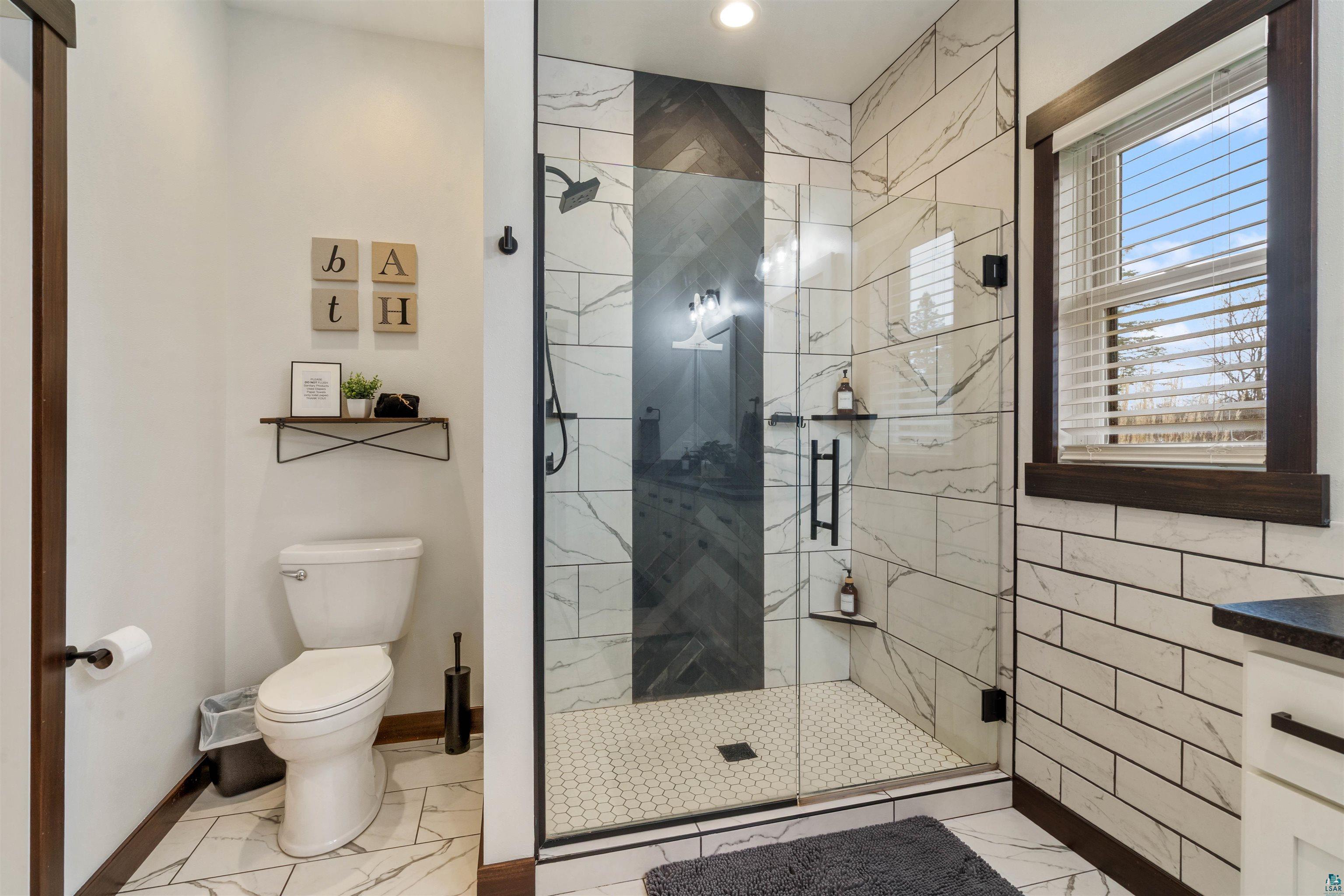59 East Riverside Road Esko, MN 55733 - Photo 27 of 48 Full bath featuring a shower stall, vanity, and recessed lighting