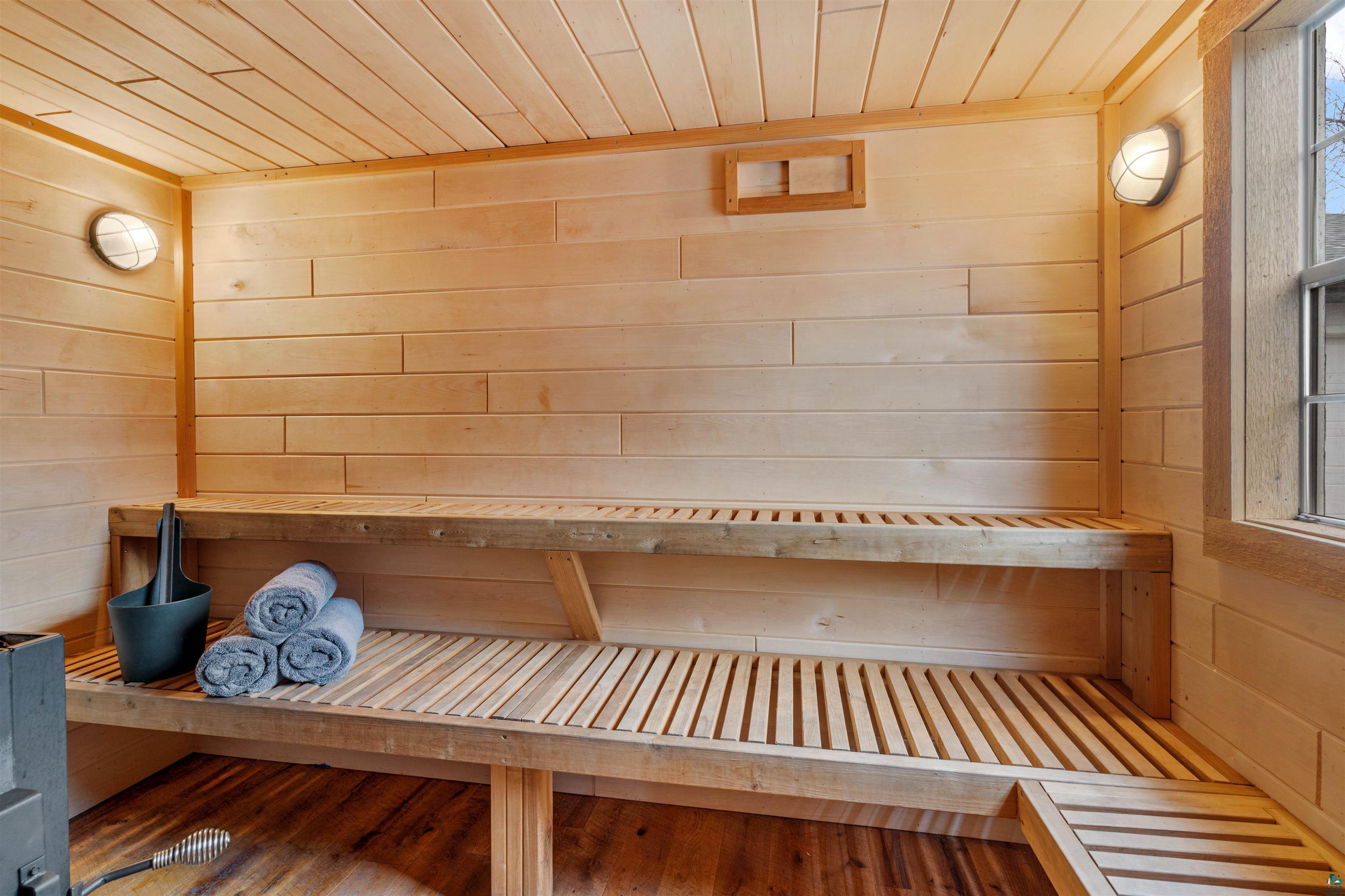 59 East Riverside Road Esko, MN 55733 - Photo 39 of 48 Relaxing sauna / steam room featuring wood ceiling and wooden walls