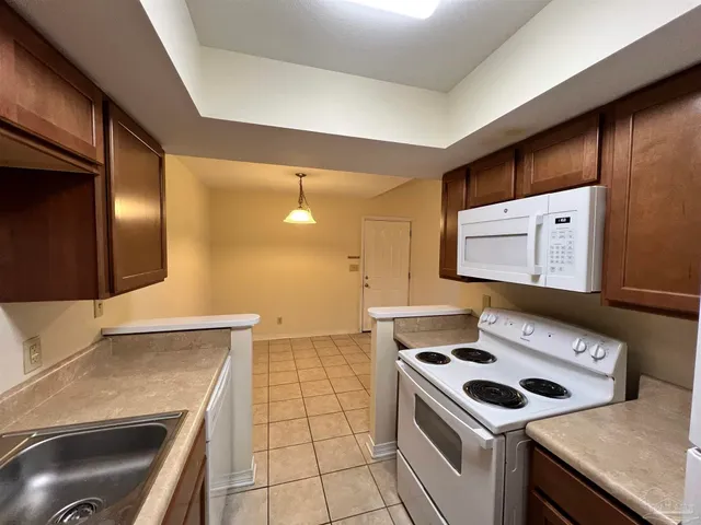 a kitchen with a stove and a sink