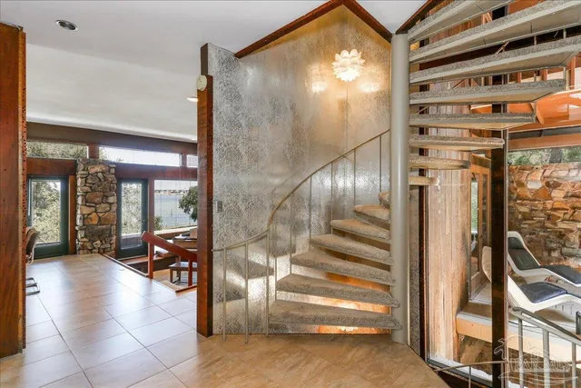 a kitchen with stainless steel appliances granite countertop a sink and a refrigerator