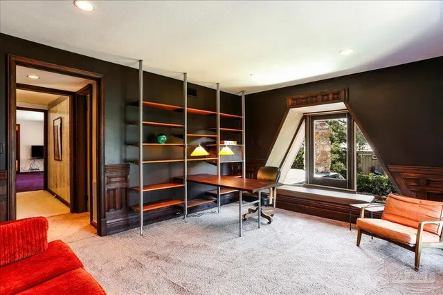 a view of a room with wooden walls