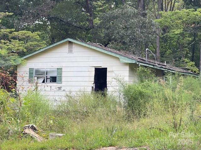 5756 Rumfelt Road Stanley, NC 28164 - Photo 5 of 5 a backyard of a house with lots of green space