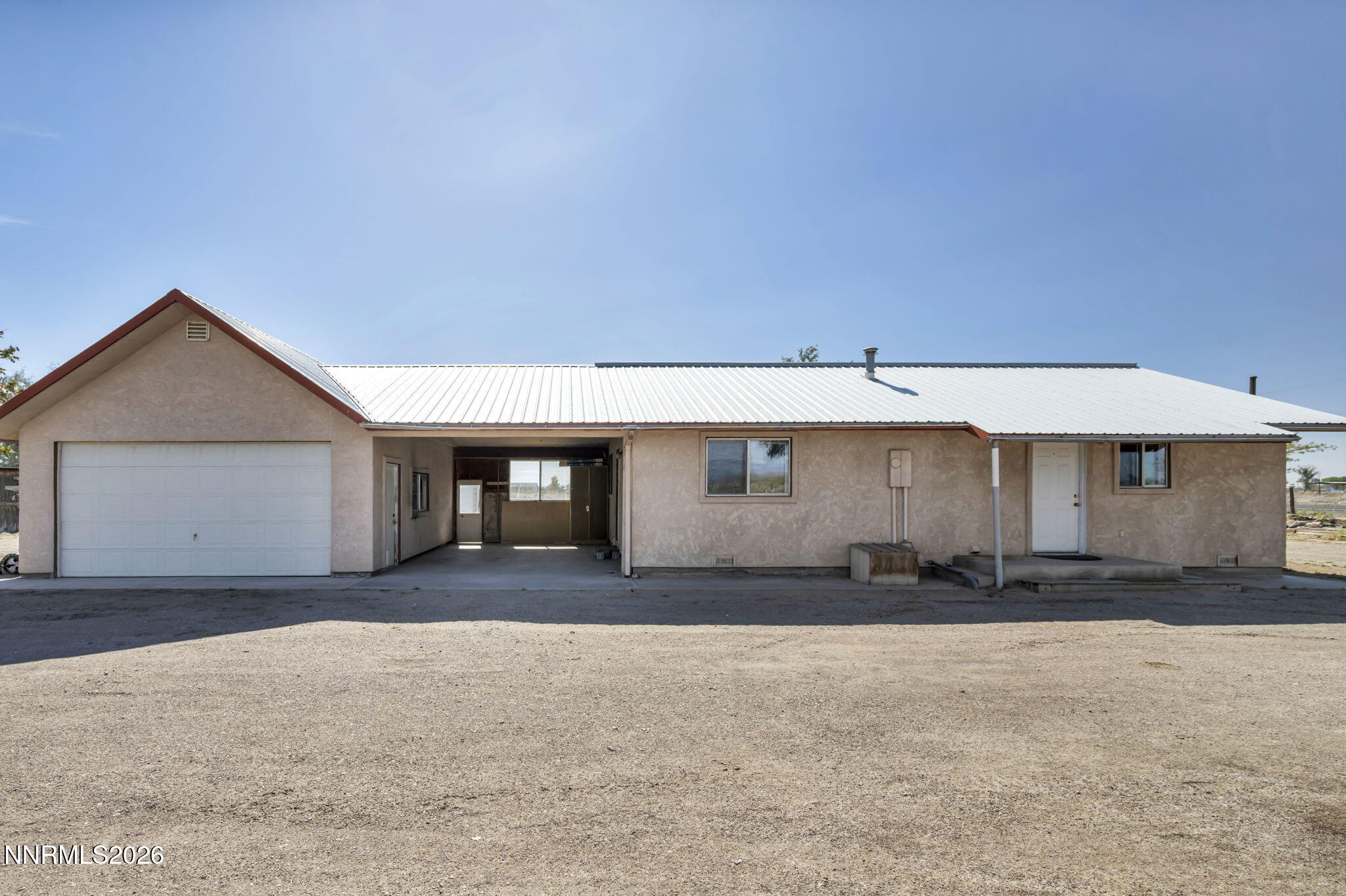 5250 Stillwater Road Fallon, NV 89406 - Photo 1 of 53 a front view of a house with a yard