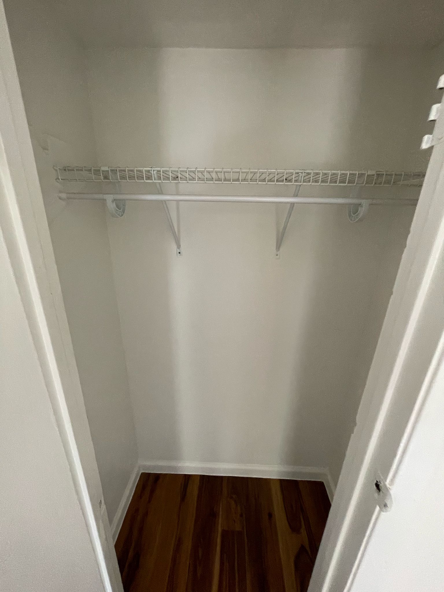 6404 Ponca Street, Unit B Austin, TX 78741 - Photo 11 of 17 a view of walk in closet with empty racks