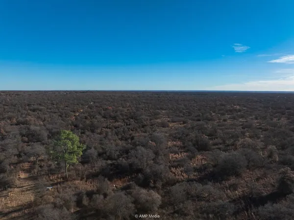 a view of residential houses with green space