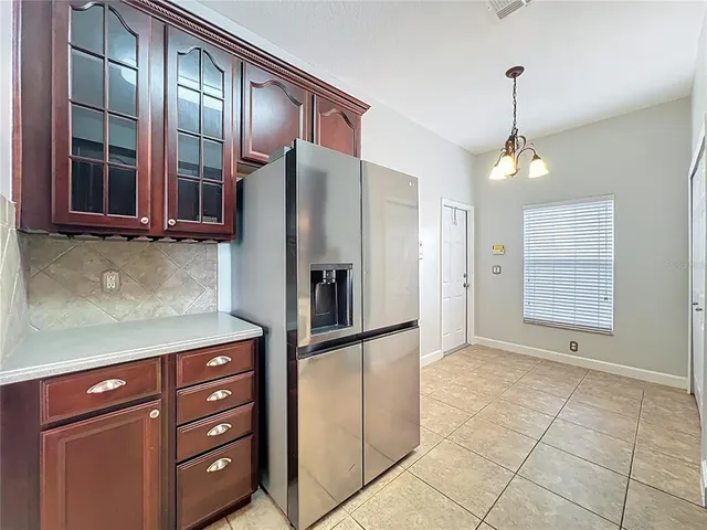 a kitchen with stainless steel appliances granite countertop a sink and cabinets