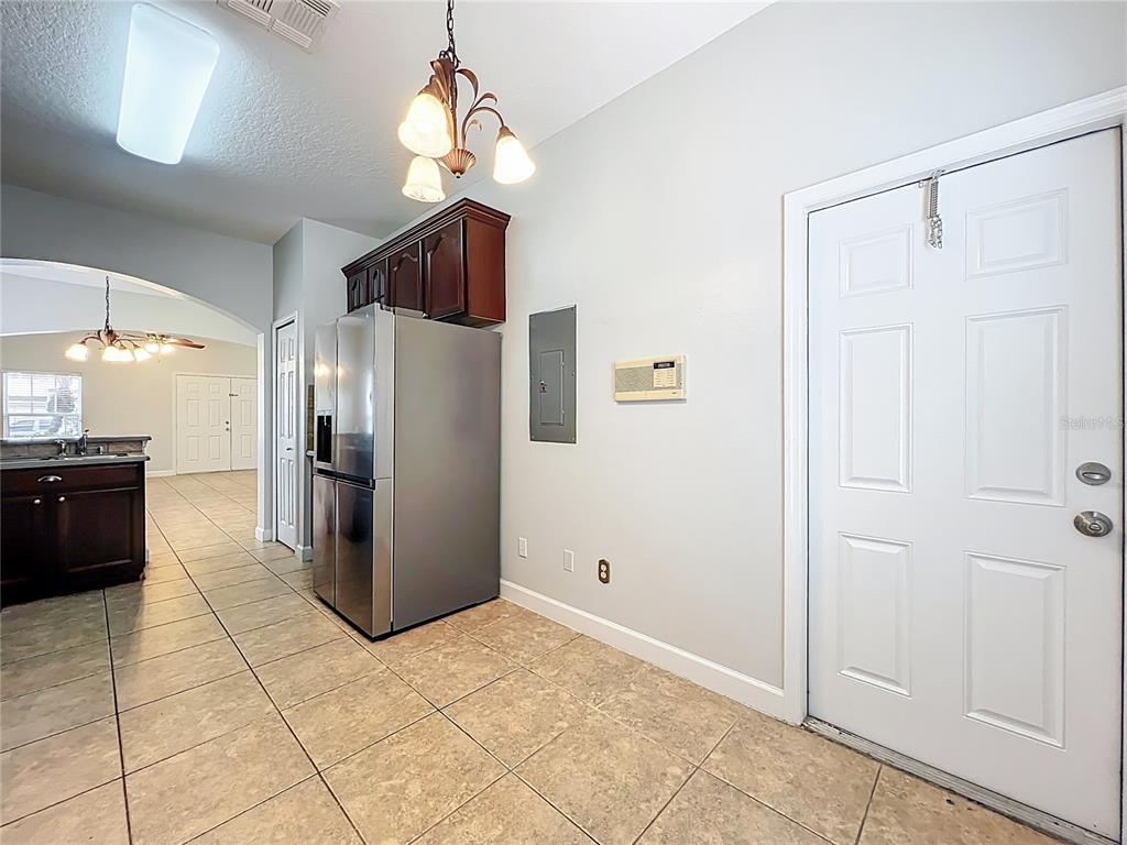 16178 Old Ash Loop Orlando, FL 32828 - Photo 16 of 58 a kitchen with stainless steel appliances granite countertop a refrigerator and a sink