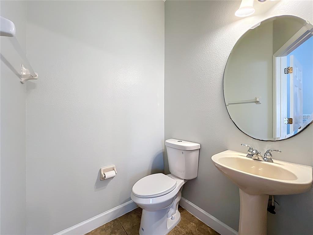 16178 Old Ash Loop Orlando, FL 32828 - Photo 18 of 58 a bathroom with a sink toilet and a mirror