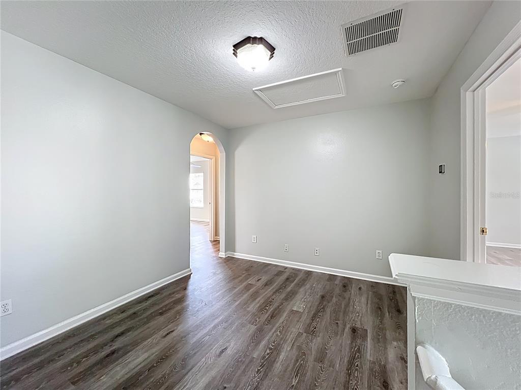 16178 Old Ash Loop Orlando, FL 32828 - Photo 29 of 58 a view of empty room with wooden floor