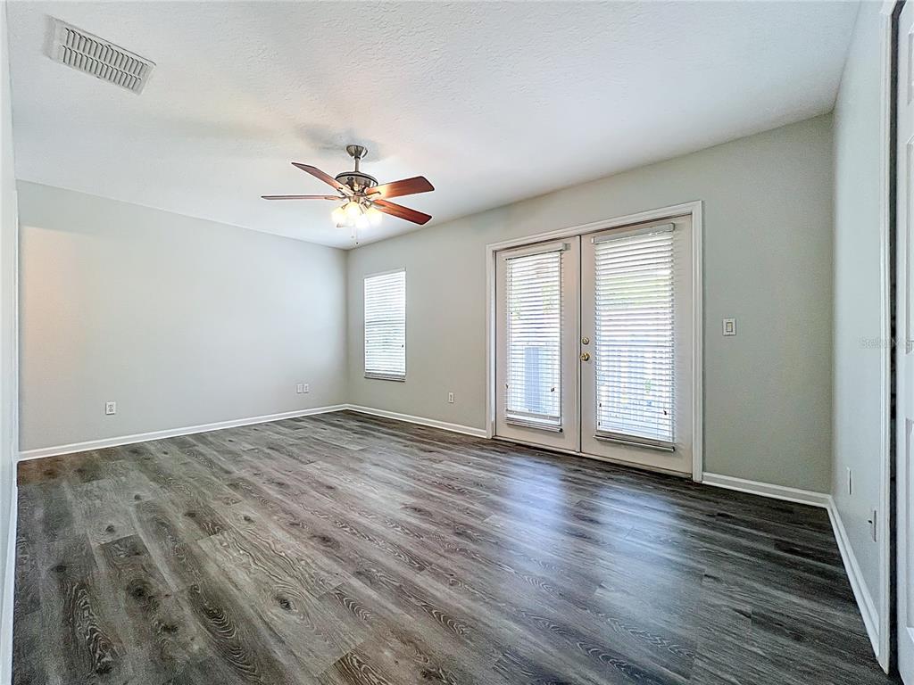 16178 Old Ash Loop Orlando, FL 32828 - Photo 38 of 58 wooden floor in an empty room with a window