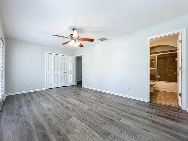 a view of a porch with wooden floor and fence