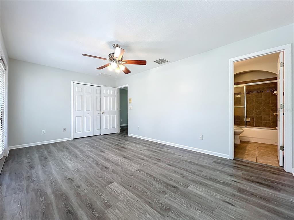 16178 Old Ash Loop Orlando, FL 32828 - Photo 40 of 58 wooden floor in an empty room with a window
