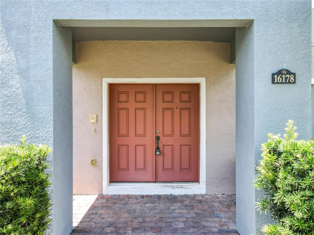 16178 Old Ash Loop Orlando, FL 32828 - Photo 4 of 58 a view of front door of a house