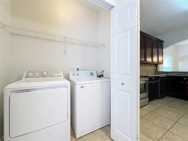 a view of a livingroom with a chair and table