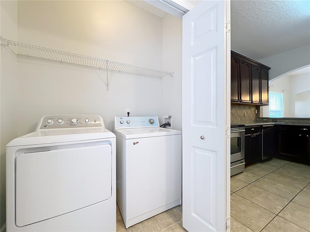 16178 Old Ash Loop Orlando, FL 32828 - Photo 42 of 58 a utility room with dryer and washer