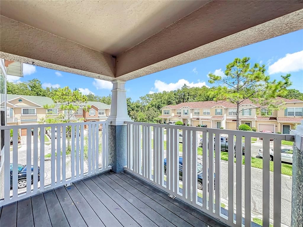 16178 Old Ash Loop Orlando, FL 32828 - Photo 43 of 58 a view of a porch with wooden floor and fence
