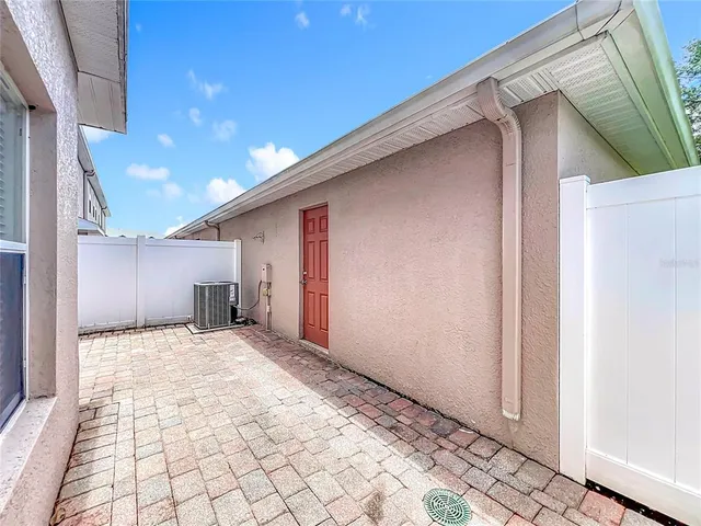 an aerial view of residential houses with outdoor space and swimming pool