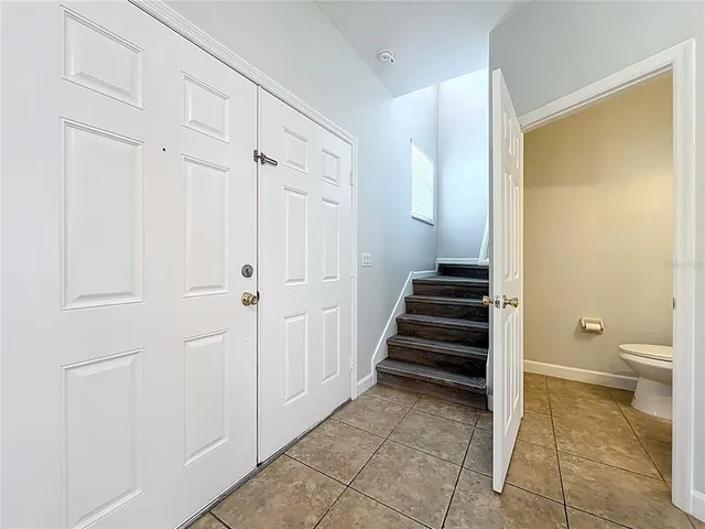 a view of a hallway with a elevator and a bathroom